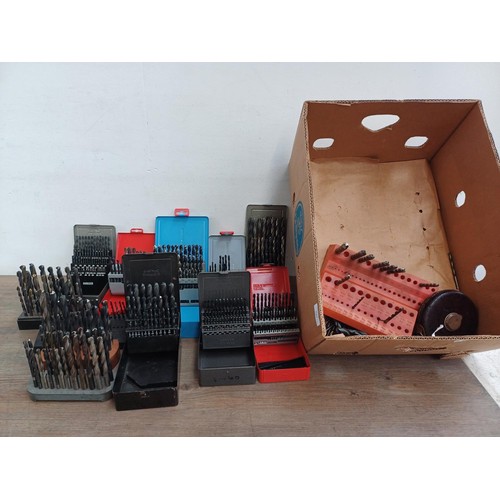 1064 - Two boxes, one containing a large quantity of cased mostly Dormer drill bit sets and one containing ... 