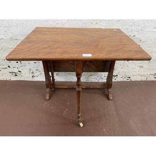 61 - A late 19th/early 20th century mahogany drop leaf Sutherland table - approx. 57cm high x 60cm wide x... 