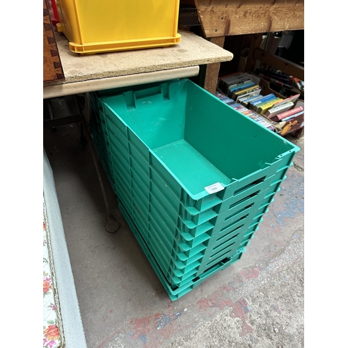 1101 - Twenty green plastic stacking storage boxes