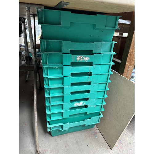 1101 - Twenty green plastic stacking storage boxes