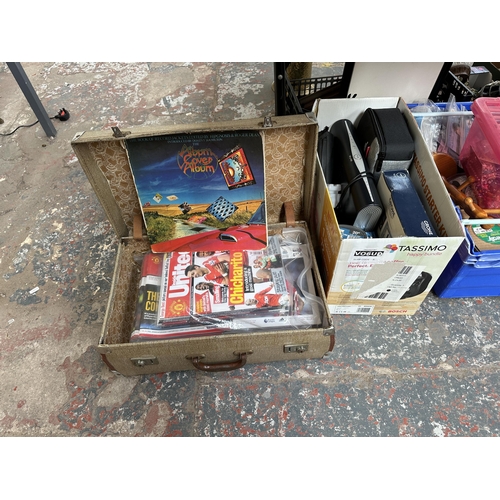 1107 - Four boxes containing Manchester United magazines, metal violin shaped candle holder, gilt framed be... 