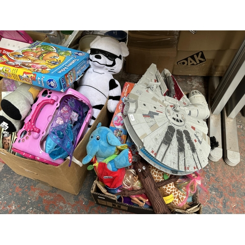 1116 - Four boxes containing a quantity of toys and games to include Star Wars soft toys, board games, Mill... 