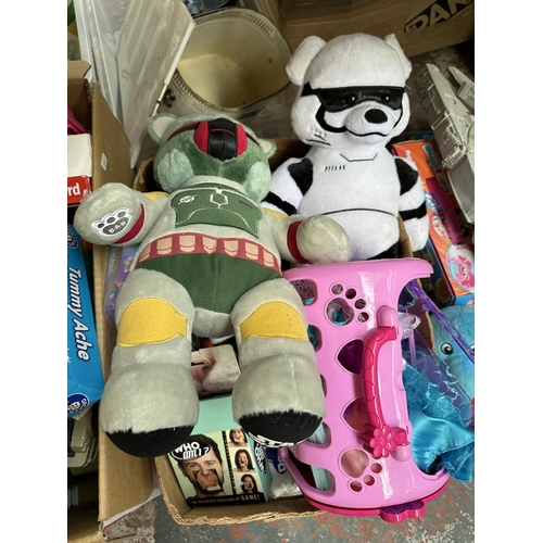 1116 - Four boxes containing a quantity of toys and games to include Star Wars soft toys, board games, Mill... 