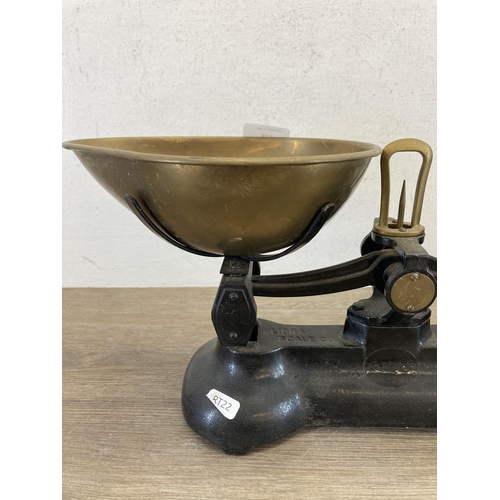 528 - A set of 19th century Libra Scale Co. cast iron and brass kitchen weighing scales