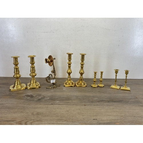 534 - Nine pieces of 19th century and later brassware, four pairs of candlesticks - largest approx. 23cm h... 