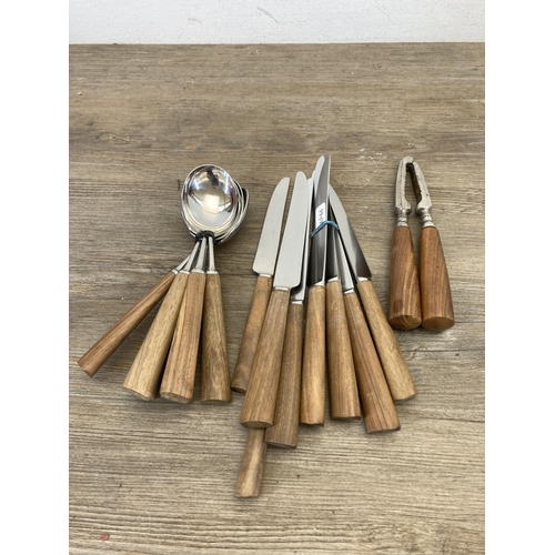 541 - A collection of mid 20th century Mills Moore teak handled cutlery