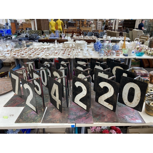 551 - Twenty three vintage hand-painted on steel cricket numbers on bespoke wrought iron stands - approx. ... 