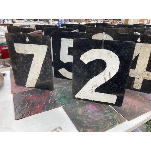 551 - Twenty three vintage hand-painted on steel cricket numbers on bespoke wrought iron stands - approx. ... 