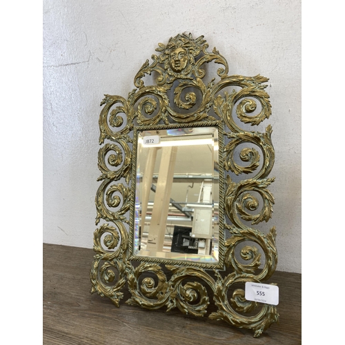 555 - Two brass framed items, one 19th century bevelled edge mirror - approx. 40cm high x 26cm wide and on... 