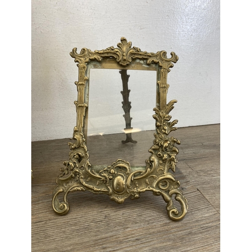 555 - Two brass framed items, one 19th century bevelled edge mirror - approx. 40cm high x 26cm wide and on... 