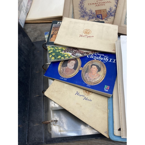 622 - A large collection of vintage collector's cards and silks to include John Player & Sons, Wills's Cig... 