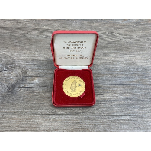 623 - A collection of commemorative medals to include 2006 'Una and the Lion' five pounds copy, Thames Bar... 