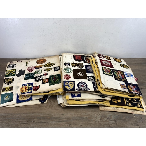 630 - A large collection of vintage college embroidered cloth patches