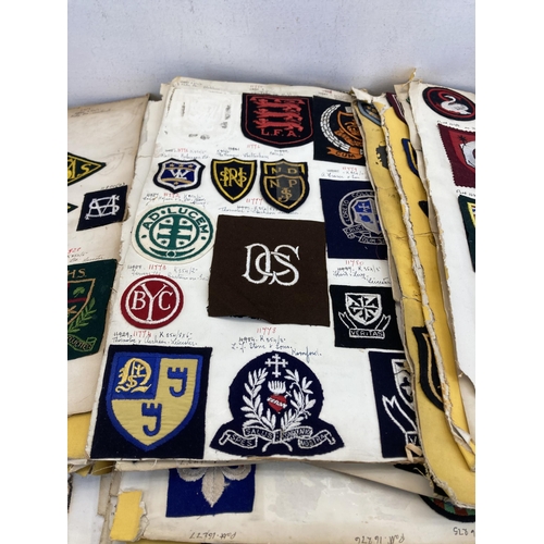 630 - A large collection of vintage college embroidered cloth patches