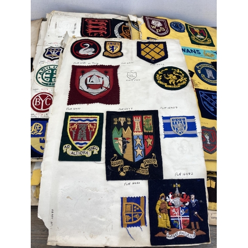 630 - A large collection of vintage college embroidered cloth patches