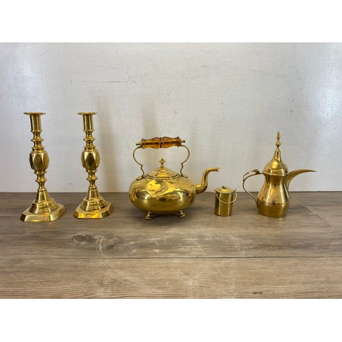 545 - Five pieces of brassware to include a pair of 19th century Diamond Princess candlesticks - approx. 2... 