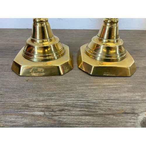 545 - Five pieces of brassware to include a pair of 19th century Diamond Princess candlesticks - approx. 2... 