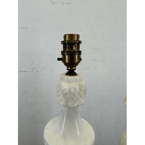 634 - Two carved alabaster table lamps - approx. 47cm high