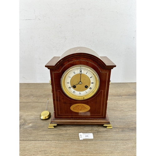 641 - An Edwardian mahogany mantel clock with domed case, oval shell inlay, boxwood and ebony stringing, b... 