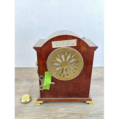 641 - An Edwardian mahogany mantel clock with domed case, oval shell inlay, boxwood and ebony stringing, b... 