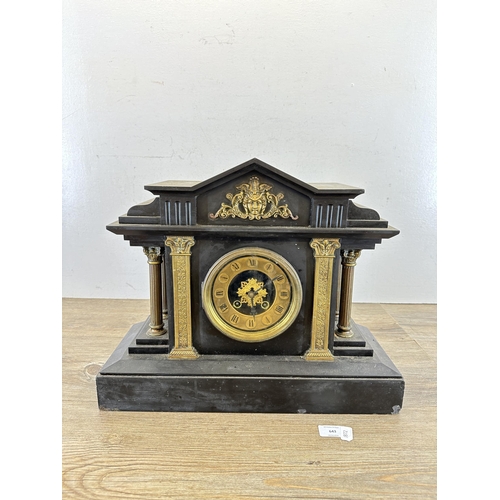 643 - A 19th century black slate and brass chiming mantel clock with Corinthian column sides and arched to... 