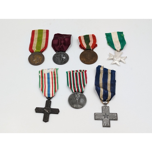 2145 - Seven Italian medals to include WWI Victory, Order of Vittorio Veneto, WWI Unity etc.