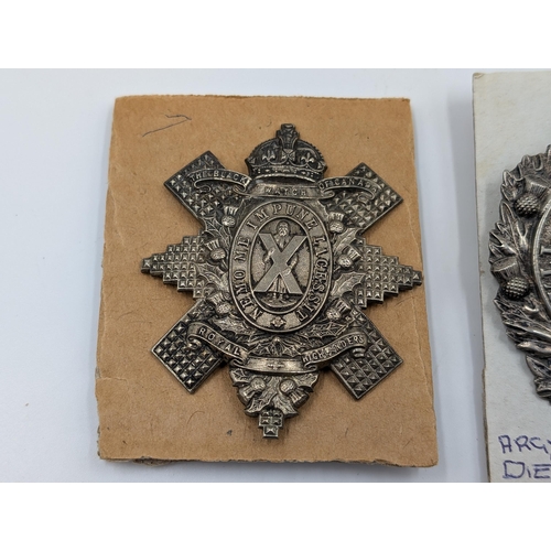 2146 - Two military cap badges, one The Royal Highlanders The Black Watch of Canada and one Argyll and Suth... 