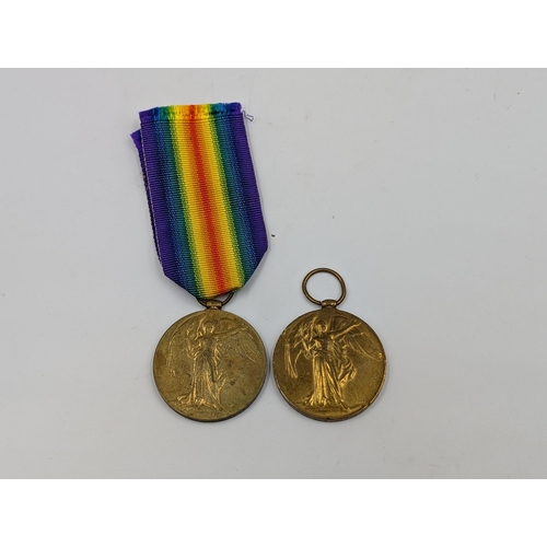 2153 - Two WWI British Victory medals, one presented to T-314329 Pte. A. J. Garbett A.S.C. and one presente... 