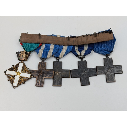 2154 - An Italian five piece medal group comprising four War Merit Cross and one Order of Merit Cross