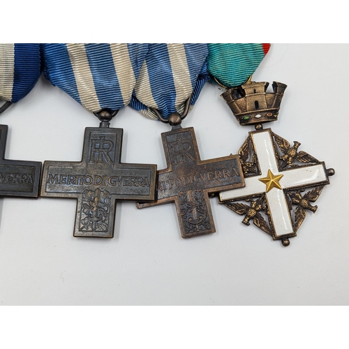 2154 - An Italian five piece medal group comprising four War Merit Cross and one Order of Merit Cross