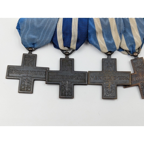 2154 - An Italian five piece medal group comprising four War Merit Cross and one Order of Merit Cross