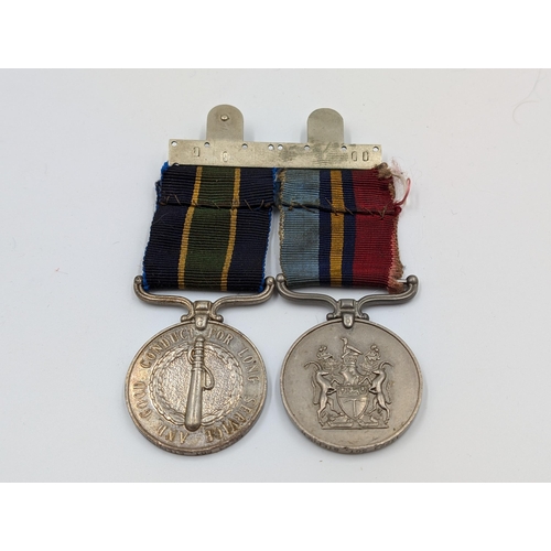 2163 - A Rhodesian medal pair presented to 14223 Sgt. Stephen