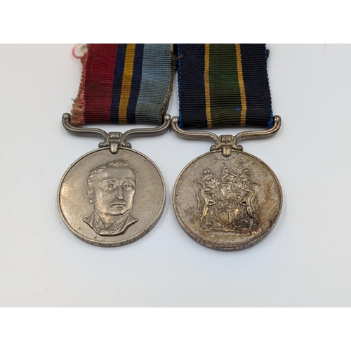 2163 - A Rhodesian medal pair presented to 14223 Sgt. Stephen