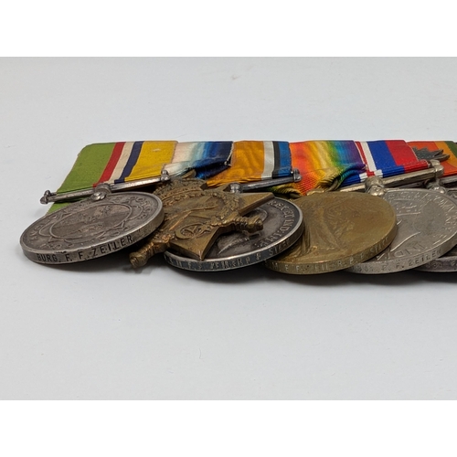 2164 - A Boer War to WWII South African ten piece medal group presented to F. F. Zeiler featuring from left... 