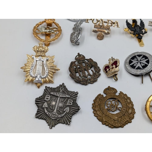 2172 - A collection of badges to include The St. John Ambulance Association, military etc.