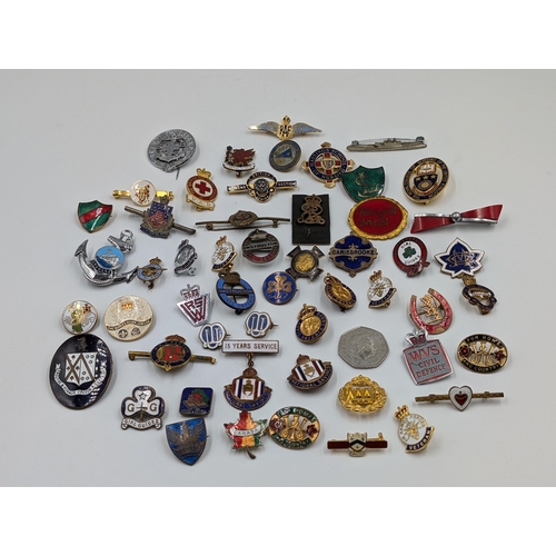 2173 - A collection of badges to include R.A.F., Royal Mail, Civil Defence etc.