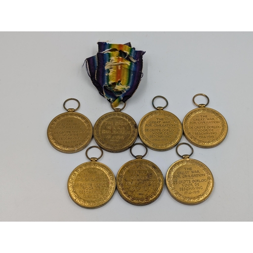 2183 - Seven WWI British Victory medals, five unnamed and two named, one presented to DM2-112189 Pte. W. J.... 