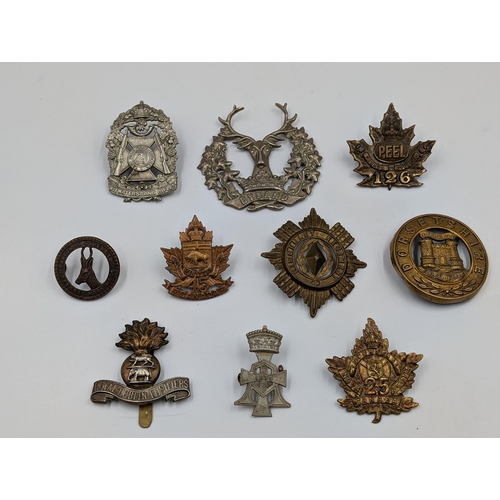 2189 - Ten military cap badges