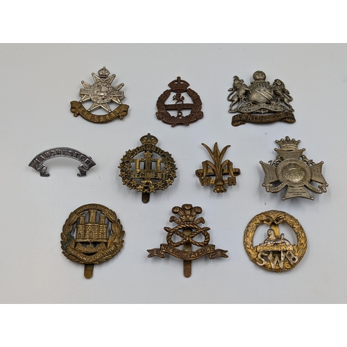 2190 - Ten military cap badges