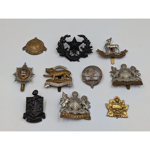 2191 - Ten military cap badges