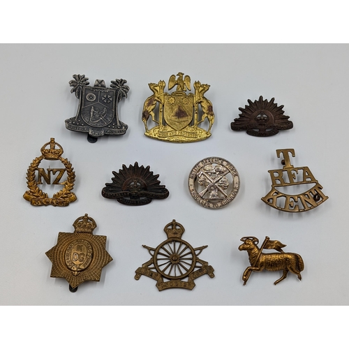 2192 - Ten military items, nine cap badges and one shoulder title