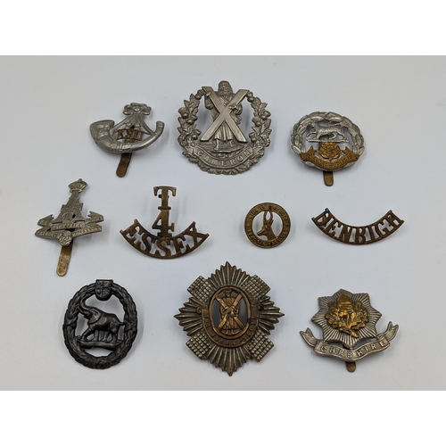 2193 - Ten military items, eight cap badges and two shoulder titles