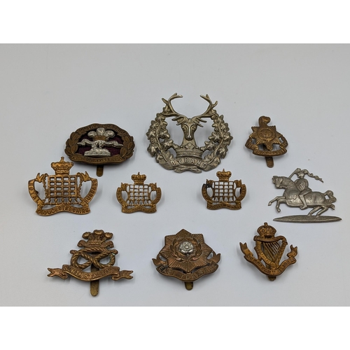 2194 - Ten military cap badges