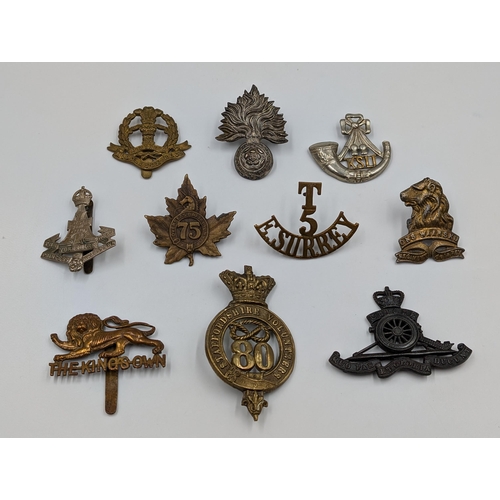 2197 - Ten military items, nine cap badges and one shoulder title