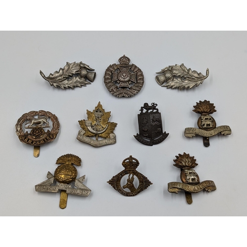 2198 - Ten military cap badges