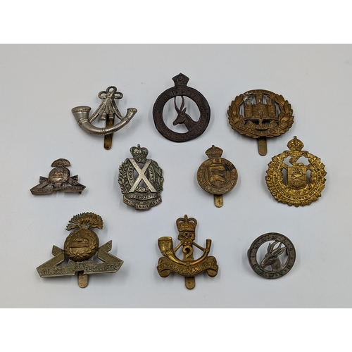 2199 - Ten military cap badges