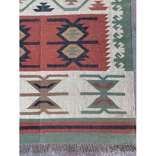 10 - A mid 20th century Kilim rug - approx. 198cm x 122cm