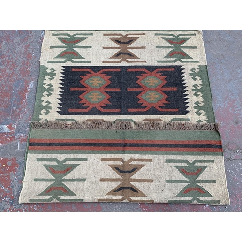 10 - A mid 20th century Kilim rug - approx. 198cm x 122cm