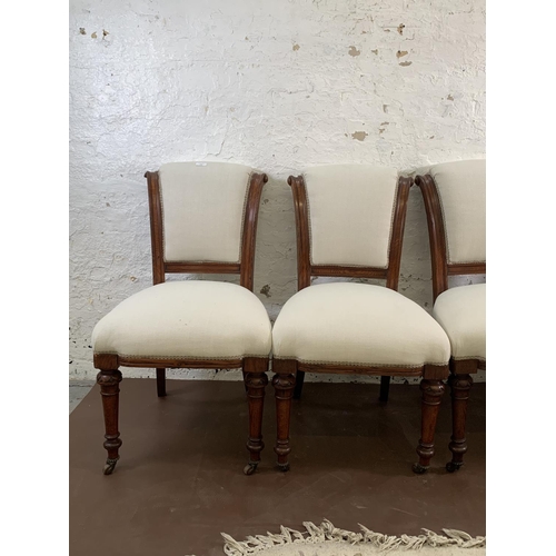 106 - Four 19th century oak and fabric upholstered dining chairs on castors