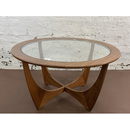 111 - A mid 20th century G Plan Astro teak and glass circular coffee table - approx. 46cm high x 83cm diam... 